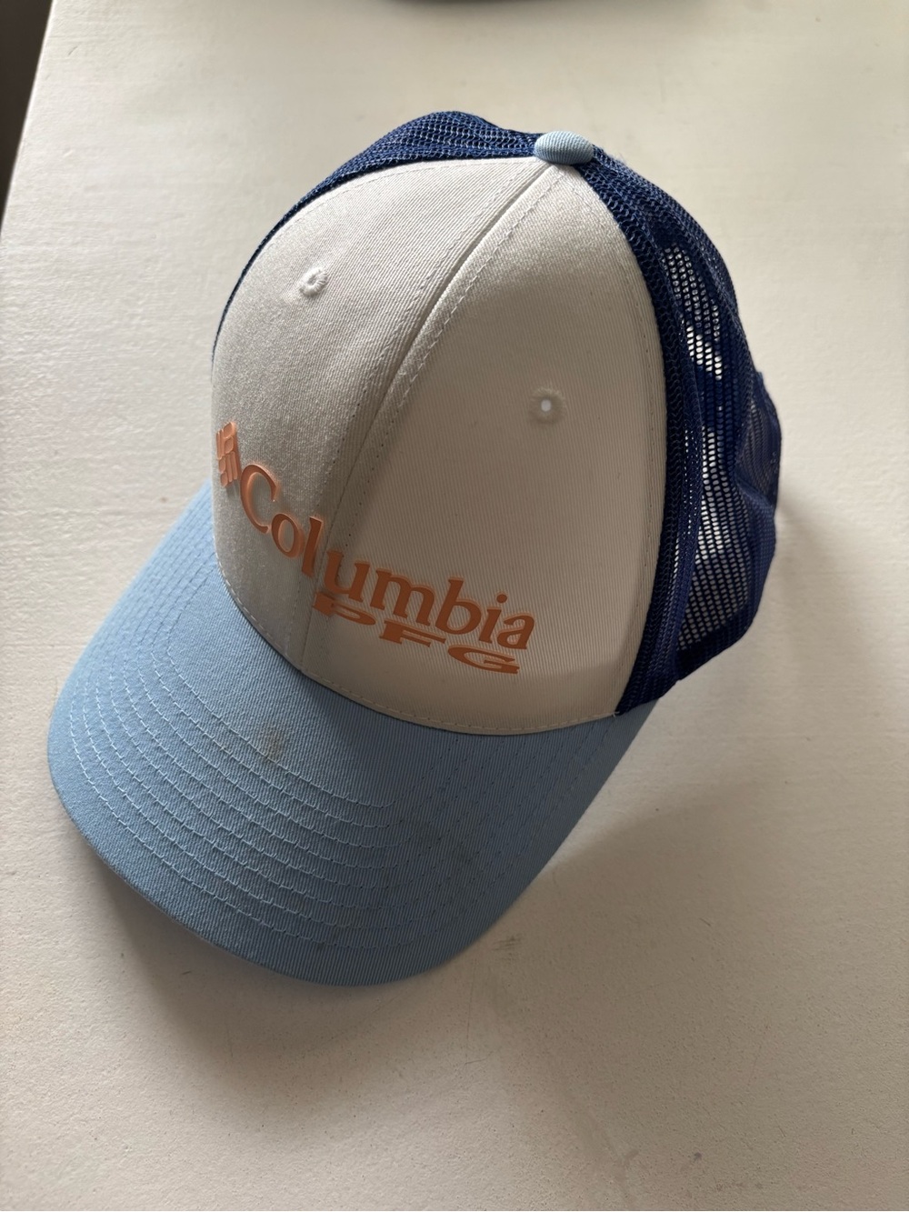 Columbia Trucker Cap in Light Blue, White & Navy with Orange Logo